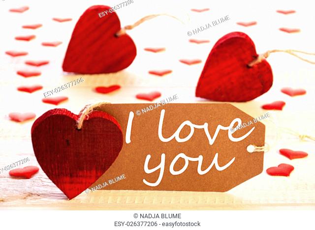 Romantic Label With Many Hearts. English Text I Love You. Wooden Background And Retro Or Vintage Style