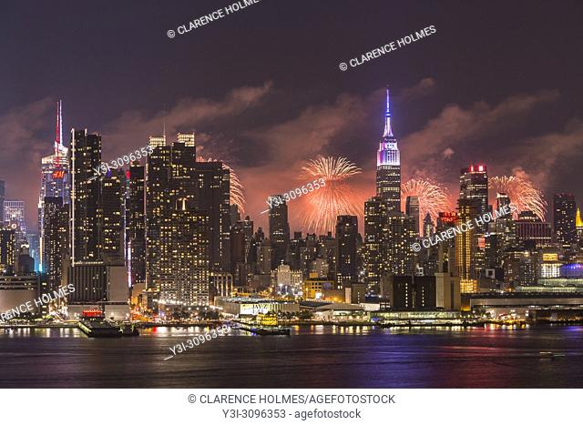 WEEHAWKEN, NJ - JULY 4: The annual Macy's Fourth of July fireworks show lights the sky behind the Manhattan skyline on Tuesday, July 4
