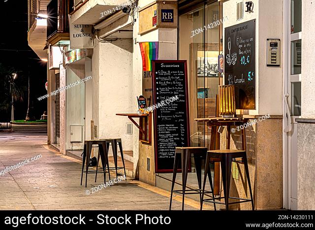 Sitges, Spain - 22 April 2018 View on the night streets of old town with open cafe