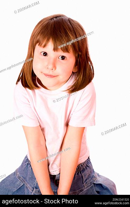 Little girl with brown eyes looking at you isolated on white