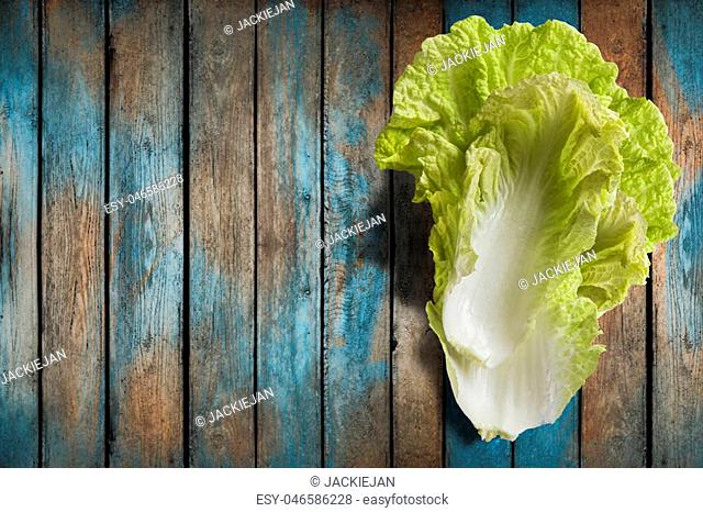Napa or Nappa cabbage on wooden background. Chinese cabbage, Brassica pekinensis