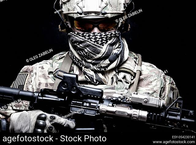 US Marine Corps soldier, army special forces fighter, modern combatant in camouflage uniform, battle helmet, tactical radio headset, face hidden behind shemagh