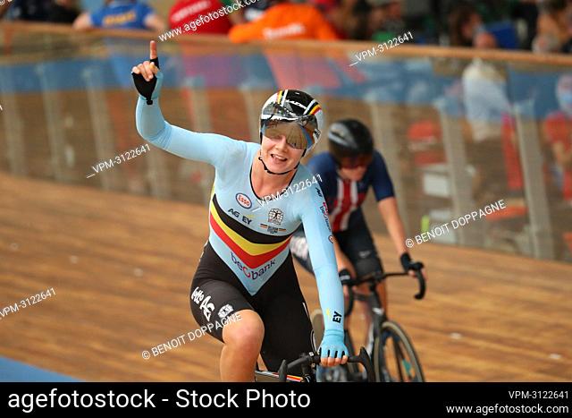Belgian Lotte Kopecky celebrates as she crosses the finish line to win the women's Points Race at the UCI track cycling World Championships, in Roubaix, France