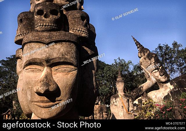 Vientiane, Laos, Asia - Buddhist and Hindu statues at the Buddha Park, also known as the Xieng Khuan sculpture park, located 25 km southeast from the capital...
