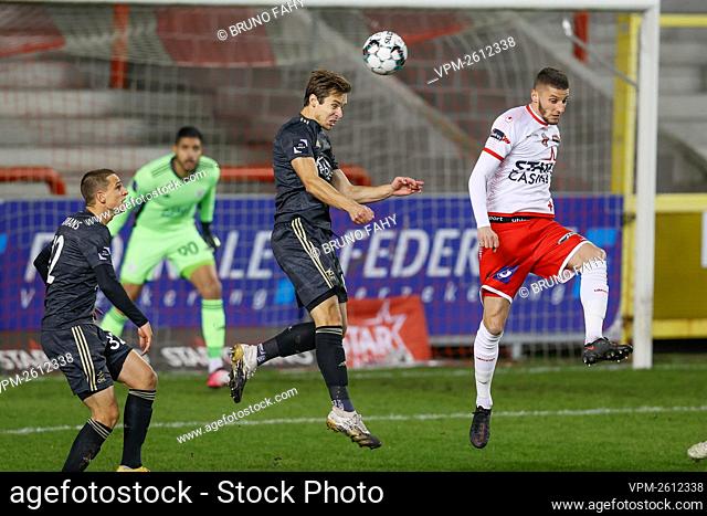 OHL's David Hubert and Mouscron's Dimitri Mohamed fight for the ball during a soccer match between RE Mouscron and Oud-Heverlee Leuven