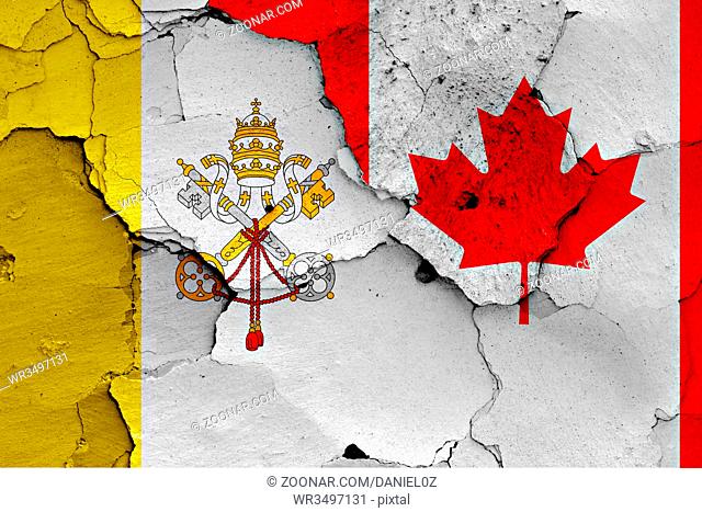 flag of Vatican and Canada painted on cracked wall
