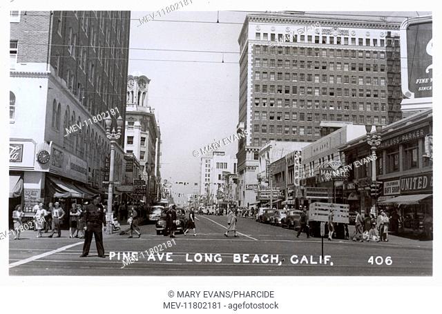 View of Pine Avenue, Long Beach, California, USA, with banks, shops, pedestrians and traffic