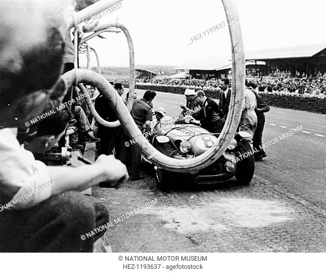 Delahaye 175S in the pits, Le Mans, France, 1951. An animated discussion is taking place between the driver and his pit crew during the Le Mans 24 Hour Race