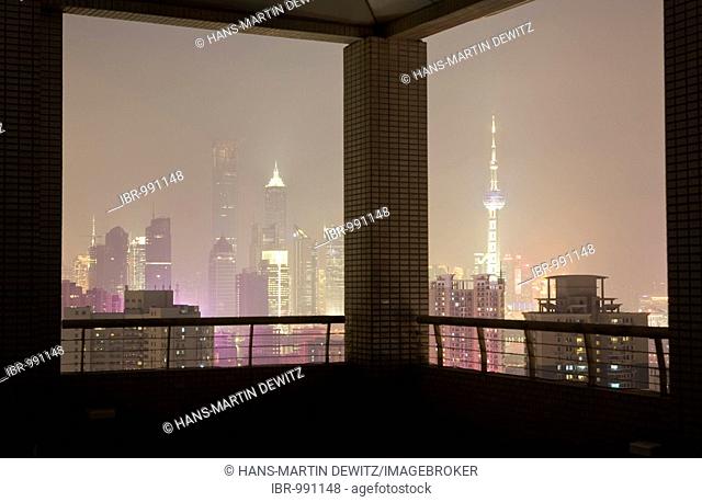View of the Pudong skyline from a roof terrace, night shot, Shanghai, China, Asia