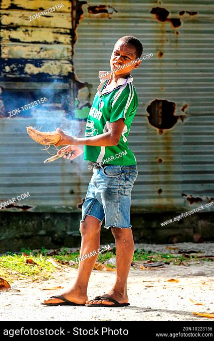Local boy smoking cigar in Lavena village on Taveuni Island, Fiji. Taveuni is the third largest island in Fiji