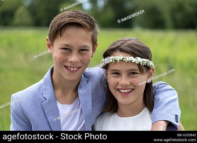 Brother and sister festively dressed, girl with flower wreath in her hair, Upper Bavaria, Bavaria, Germany, Europe