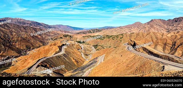 Panorama of Tizi n'Tichka mountain pass in High Atlas range, Morocco - serpentine curved roads over hills