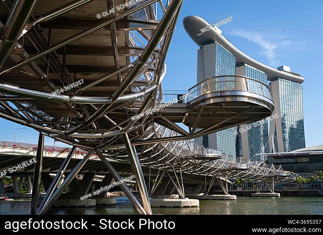 Singapore, Republic of Singapore, Asia - The Marina Bay Sands Hotel with the Helix Bridge, a pedestrian bridge linking Marina Centre with Marina South in the...