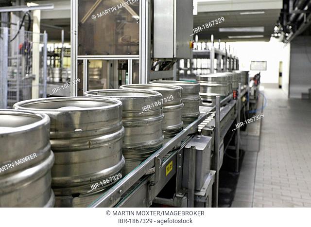 Beer kegs on a conveyor belt, waiting to be filled, Binding brewery, Frankfurt, Hesse, Germany, Europe