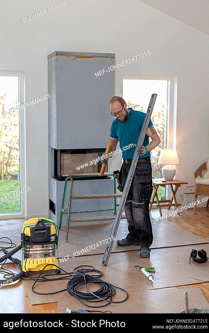 Man installing fireplace