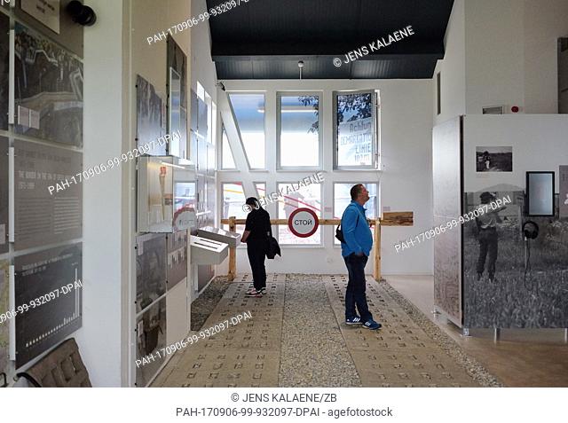 Visitors in a museum on the site of the former inner-German border separating the East German state of Thuringia from the West German state of Hesse in Geisa