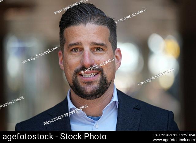 28 April 2022, Hamburg: Falk Durm, Head of Ground & Airport Experience Lufthansa Group, stands in the departure area of Hamburg Airport