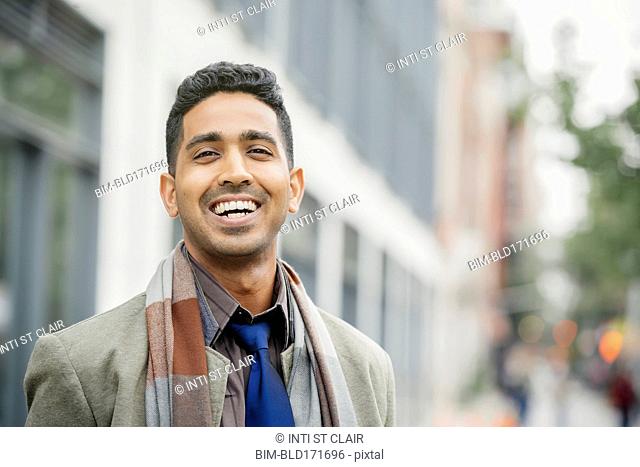 Indian man smiling in city