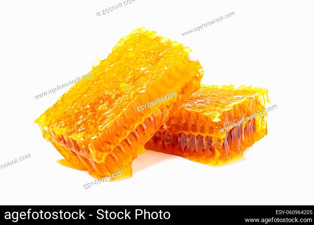 Yellow Honeycomb slice closeup isolated on white background