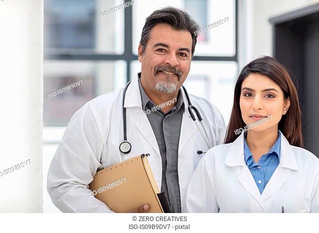 Portrait of male and female doctor