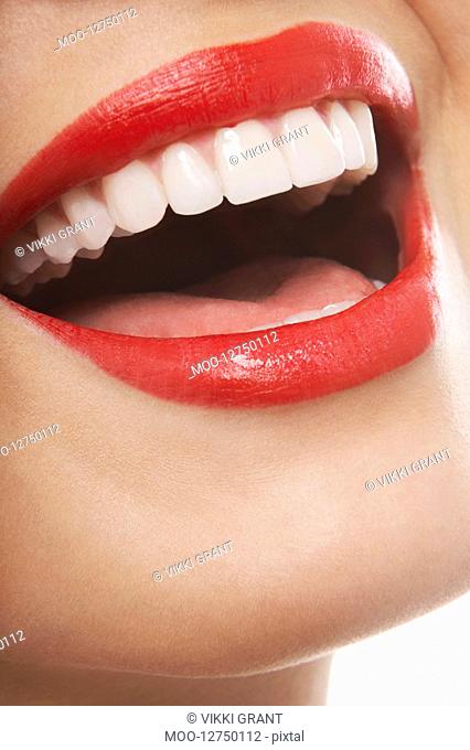 Mouth with red lipstick laughing
