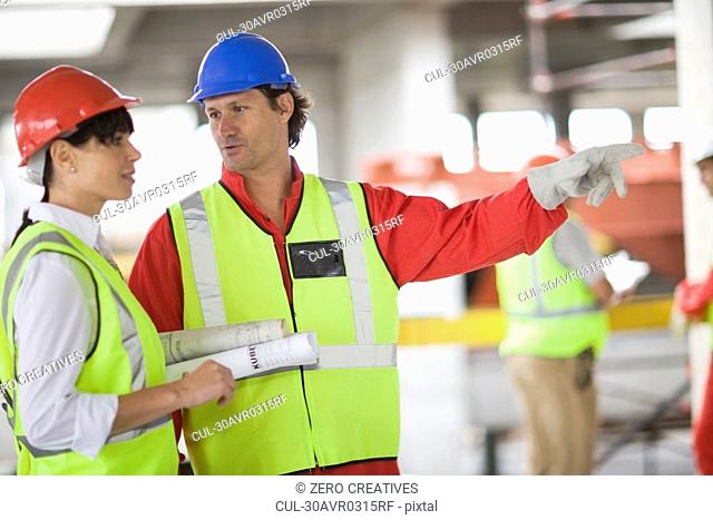 Architect talking to a builder