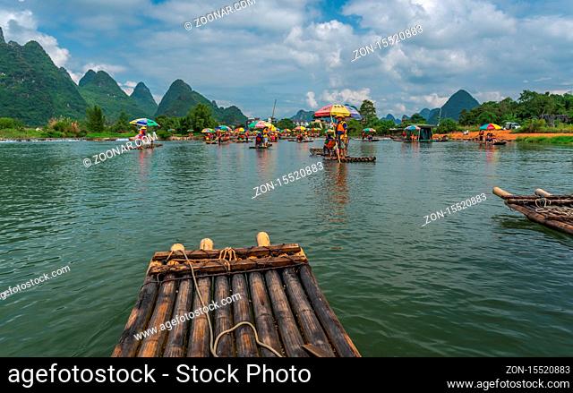 Yangshuo, China - August 2019 : Close up of bamboo raft for carrying tourists steered by guides on scenic and beautiful Yulong River