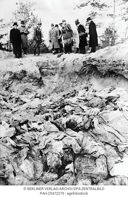 The discovery of the mass graves in Katyn (Russia) by the German Wehrmacht in February 1943 - the Nazi Propaganda! on the back of the image is dated 24 April...