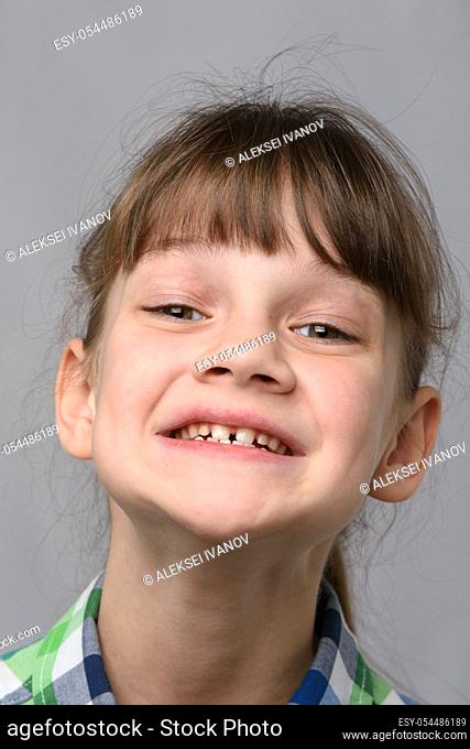 Portrait of the happiest ten-year-old girl of European appearance, close-up