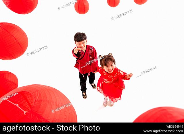 Boys and girls playing under the red lanterns