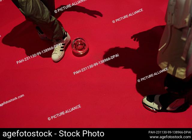 30 November 2023, North Rhine-Westphalia, Bielefeld: Otto Waalkes and Ski Aggu (r) play with prize after the ""1Live Krone"" award ceremony in the Lokschuppen...