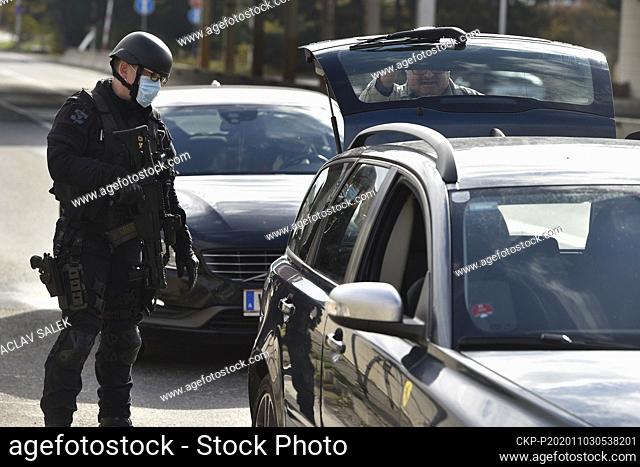 Police officer checks a car at the borders between Czech Republic and Austria in Mikulov-Drasenhofen, Czech Republic, November 3, 2020