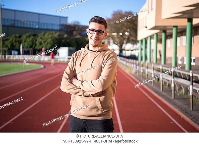 25 September 2018, Berlin: Abd Al Rahman Al Musa, a poultryman from Syria, stands on the sports grounds of the Landessportbund Berlin