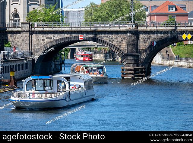 30 May 2021, Berlin: Ships sail on the Spree at the Museum Island. The relaxation of the Corona Ordinance in Berlin makes it possible that ""Historic City...