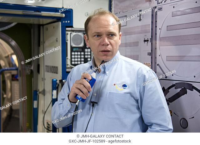 Russian cosmonaut Oleg Kotov, Expedition 37 flight engineer and Expedition 38 commander, talks on a microphone during a routine operations training session in...