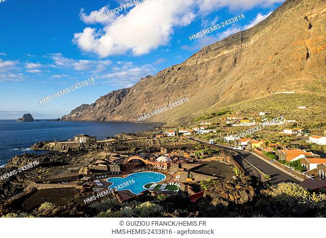 Spain, Canary Islands, El Hierro island declared a Biosphere Reserve by UNESCO, Las Puntas, Cascadas del Mar water park and Roques de Salmor in the background