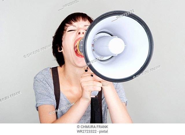 angry, announce, announcement, attractive, background, bullhorn, Caucasian, communication, concept, expression, female, girl, holding, isolated, loud
