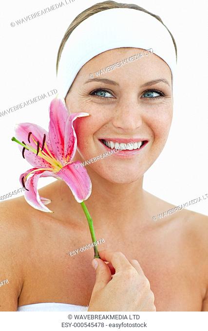 Charning woman holding a flower against a white background