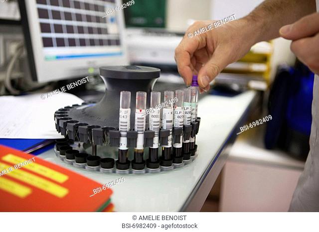 Photo essay at the hospital of la Croix Saint-Simon, Paris, France. Laboratory. Tube rack of Minicap automaton
