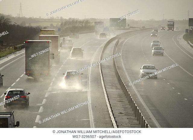 UK Bedfordshire -- 12 Feb 2014 -- Hazardous conditions on the busy A421 near Bedford England UK this afternoon as high winds from a large Atlantic storm caused...