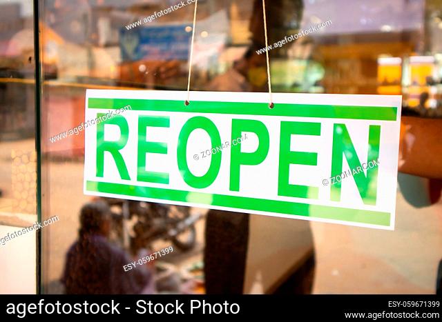 Reopen Signage board in front of Businesses or store door after covid-19 or coronavirus crisis- Concept of back to business after lockdown