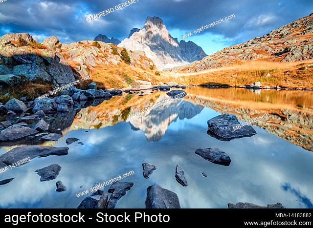 Cavallazza lakes in the Lagorai mountain ridge, mont Cimon de la Pala (Dolomites) reflected in the water mirror in autumn, rolle pass, Trentino Alto Adige