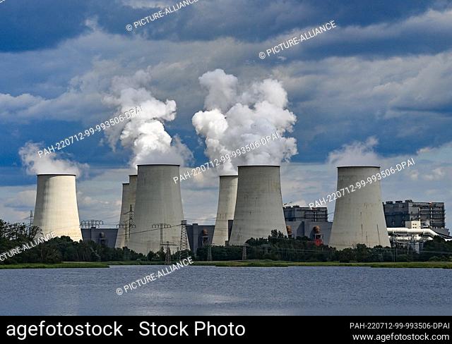 11 July 2022, Brandenburg, Jänschwalde: Steam rises from the cooling towers of the Jänschwalde lignite-fired power plant of Lausitz Energie Bergbau AG (LEAG)