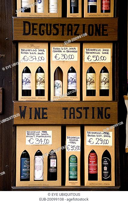 Val DOrcia Brunello di Montalcino Enoteca or wine shop with display of boxed wines with a wine tasting sign with prices in Euros