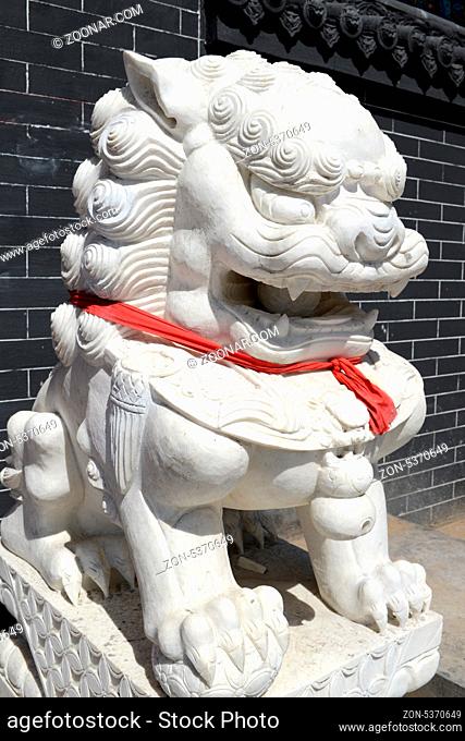 Chinese Imperial Lion Statue with a red scarf