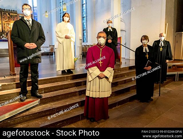 13 March 2021, Schleswig-Holstein, Kiel: Helge Frey (l-r), Protestant pastor, Laura Gaborro, parish assistant, Stefan Heße, Catholic archbishop of Hamburg