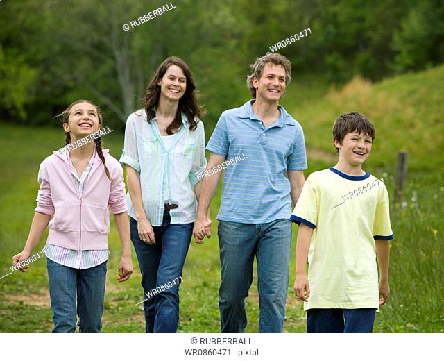 woman and a man with their son and daughter