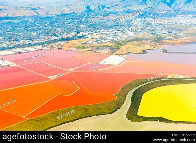 Aerial photo of vivid red salt ponds at Don Edwards San Francisco Bay National Wildlife Refuge. California, USA