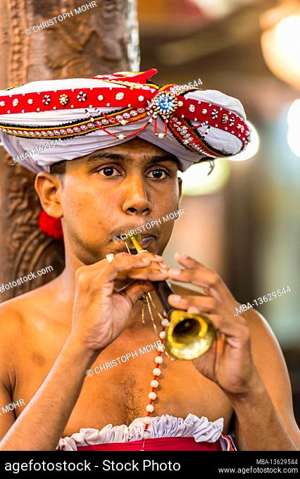 Sri Lanka, Colombo, Gangaramaya temple, man, young, flute, portrait