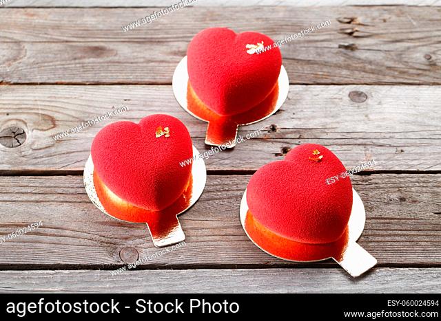 Bouquet of red roses on wooden background, copy space